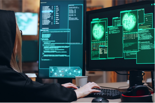 A woman with two monitor with terminal on the screens